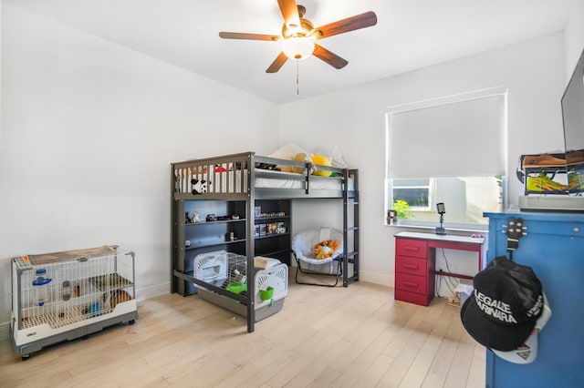 bedroom featuring ceiling fan and light hardwood / wood-style floors