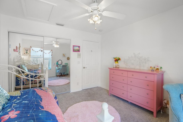 bedroom with light colored carpet, a closet, and ceiling fan