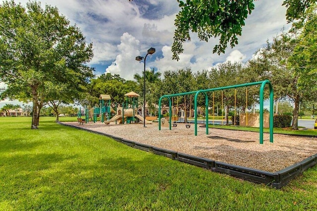 view of playground with a lawn