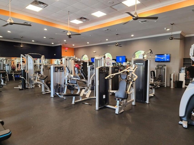 gym with crown molding and ceiling fan