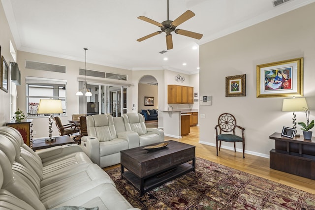 11380 SW Aspen Ln, Port Saint Lucie, FL 34987 - living room featuring crown molding, light hardwood / wood-style floors, and ceiling fan