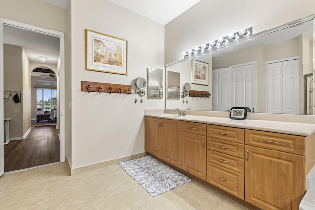 11380 SW Aspen Ln, Port Saint Lucie, FL 34987 - bathroom featuring vanity, tile patterned floors, and ceiling fan