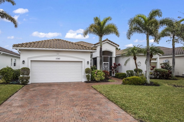 11380 SW Aspen Ln, Port Saint Lucie, FL 34987 - mediterranean / spanish home with a garage and a front lawn