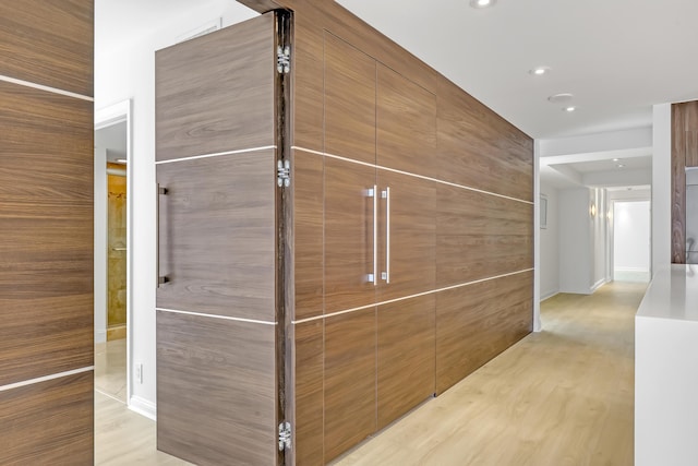 4000 S Ocean Blvd Unit 401, South Palm Beach, FL 33480 - hallway with light wood-type flooring and recessed lighting