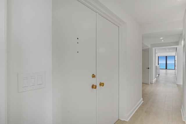 4000 S Ocean Blvd Unit 401, South Palm Beach, FL 33480 - hallway featuring baseboards, light wood-style flooring, and recessed lighting