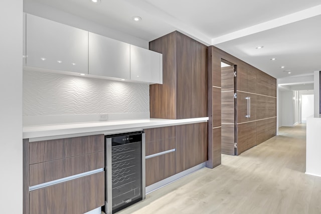 4000 S Ocean Blvd Unit 401, South Palm Beach, FL 33480 - kitchen featuring wine cooler, light wood-style floors, recessed lighting, light countertops, and modern cabinets
