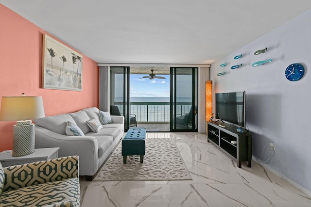 living room featuring floor to ceiling windows and ceiling fan