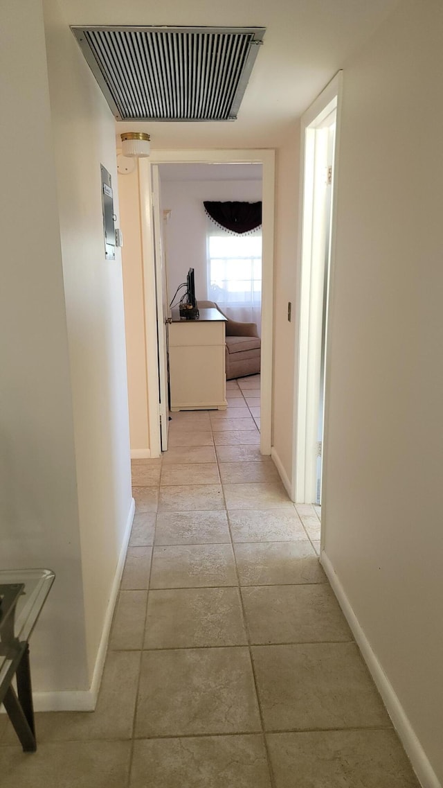 hallway with light tile patterned floors