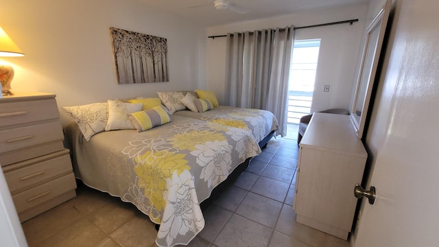 bedroom featuring ceiling fan and tile patterned flooring