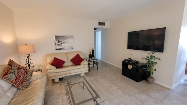 living room with light tile patterned floors