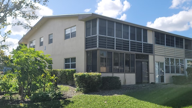 back of house with a yard