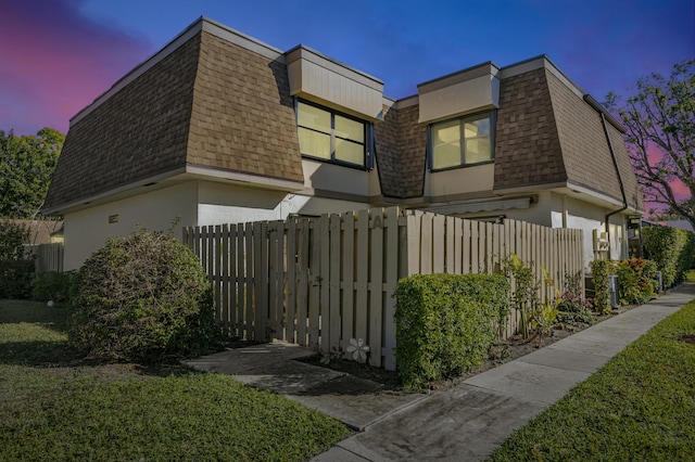 view of property exterior at dusk