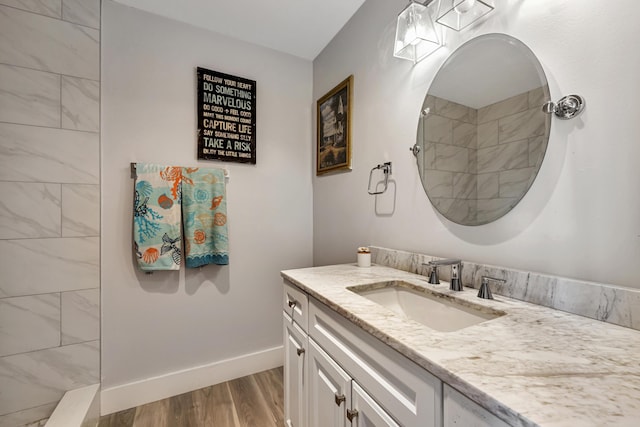 bathroom with wood-type flooring and vanity