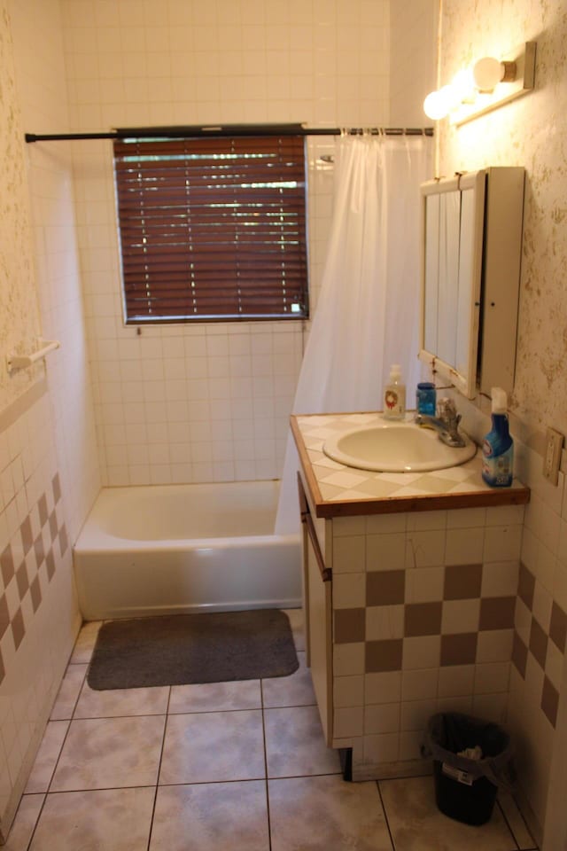 bathroom featuring tile patterned flooring, vanity, and shower / bath combo