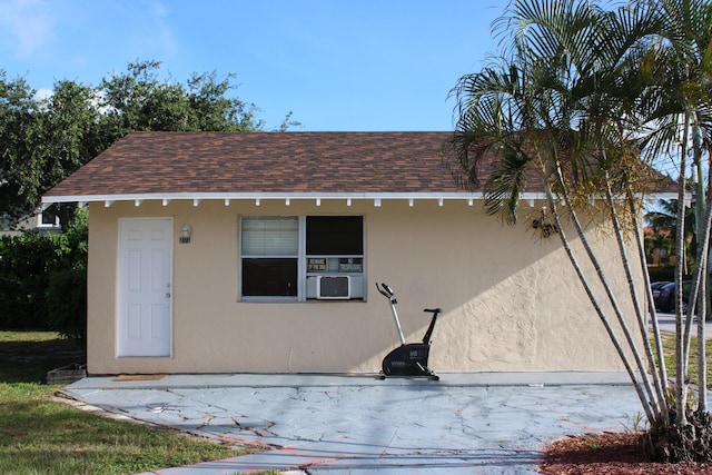 view of outbuilding with cooling unit