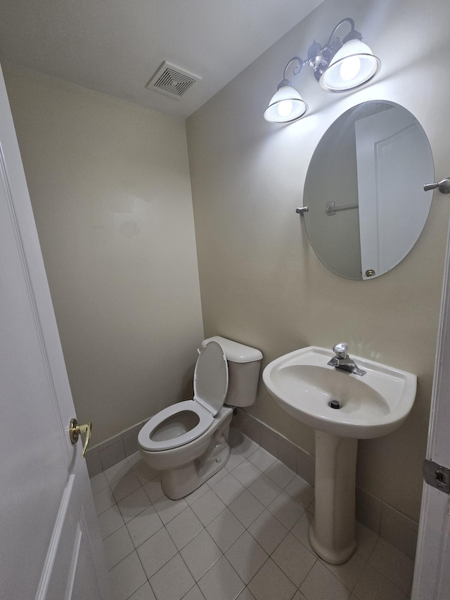 bathroom with sink, tile patterned floors, and toilet