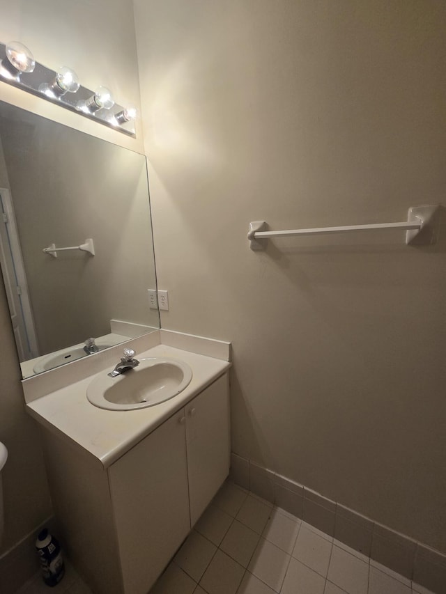 bathroom with tile patterned flooring and vanity