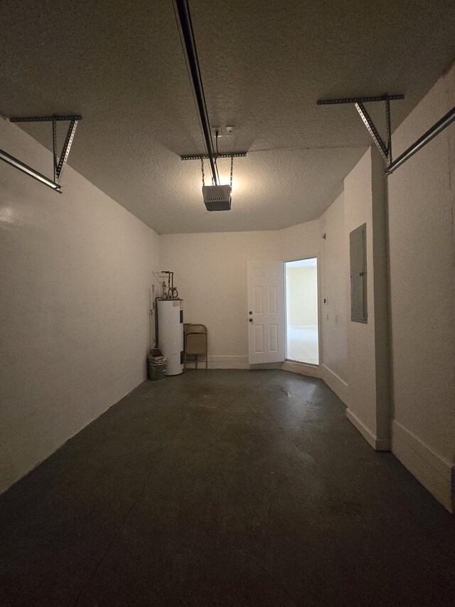 garage with a garage door opener, electric panel, and water heater