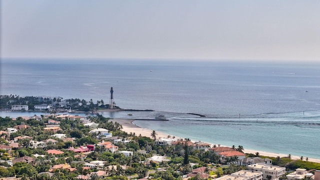 aerial view featuring a water view and a beach view