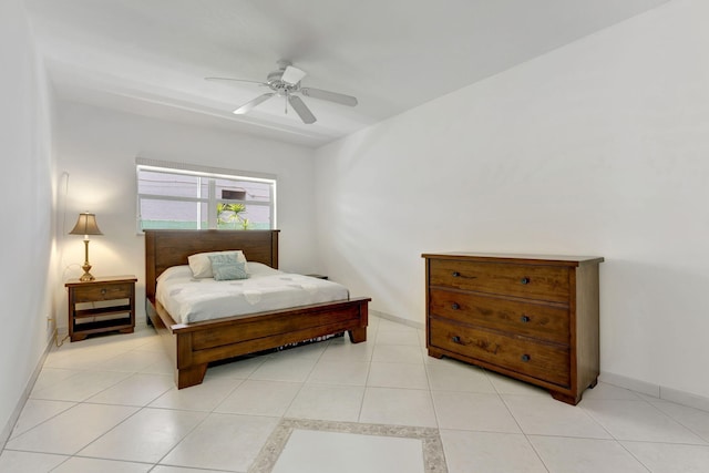 tiled bedroom with ceiling fan