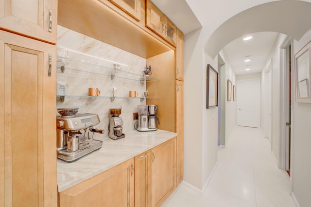 7551 Monticello Way, Boynton Beach, FL 33437 - bar area featuring arched walkways, light tile patterned floors, and recessed lighting