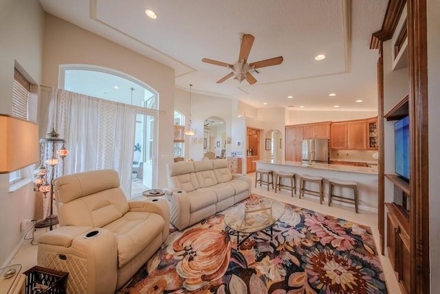 living room featuring lofted ceiling and ceiling fan