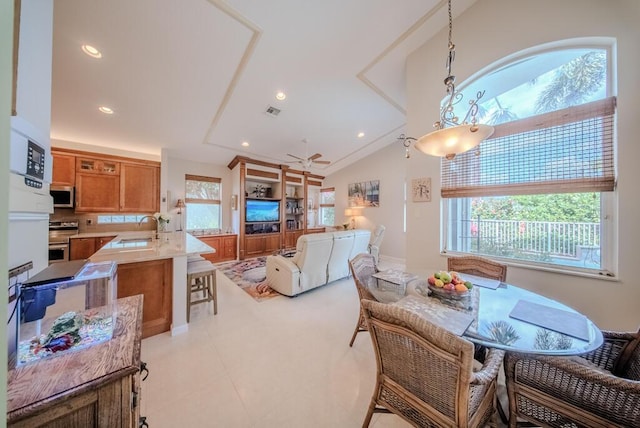 7551 Monticello Way, Boynton Beach, FL 33437 - dining space with recessed lighting, lofted ceiling, and light tile patterned floors