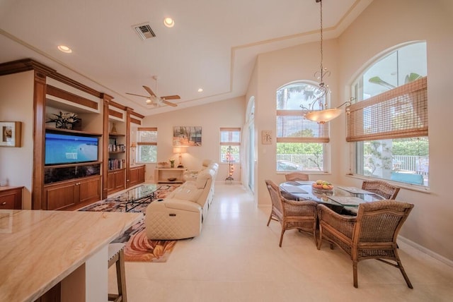 interior space with high vaulted ceiling and ceiling fan