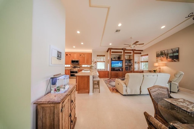7551 Monticello Way, Boynton Beach, FL 33437 - living area with ceiling fan, recessed lighting, and lofted ceiling