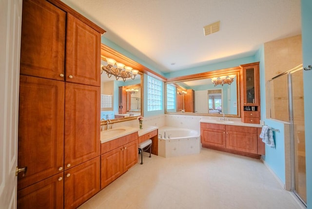 bathroom with vanity, shower with separate bathtub, and a notable chandelier