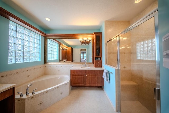 7551 Monticello Way, Boynton Beach, FL 33437 - full bathroom featuring vanity, a bath, a shower stall, a chandelier, and recessed lighting