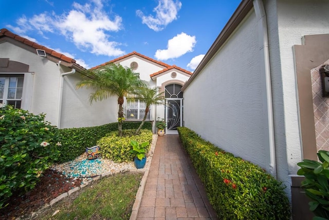 7551 Monticello Way, Boynton Beach, FL 33437 - doorway to property with stucco siding and a tiled roof