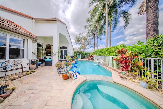 view of swimming pool featuring a patio and pool water feature