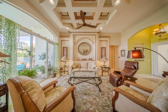 sitting room featuring beamed ceiling, coffered ceiling, and a towering ceiling