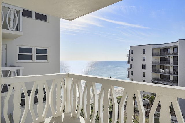 balcony featuring a water view