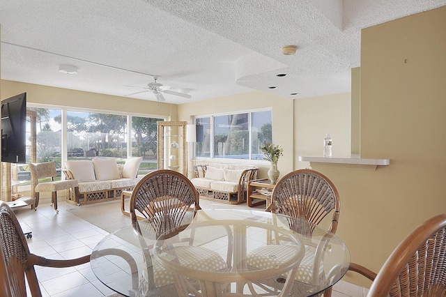 interior space with ceiling fan