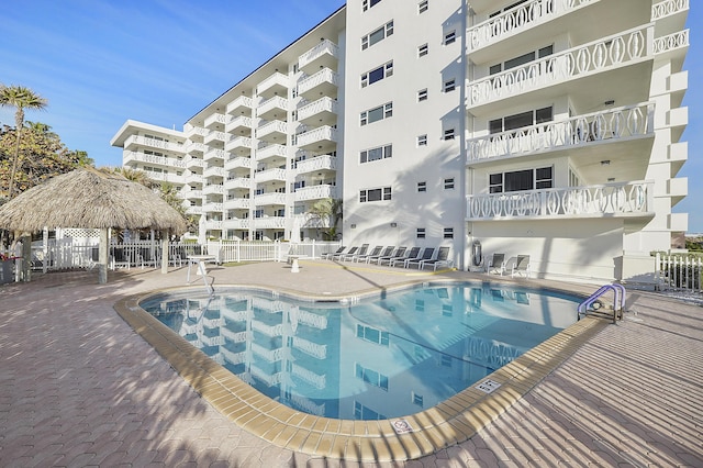 view of swimming pool featuring a gazebo and a patio area