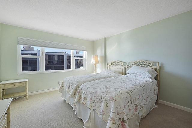 carpeted bedroom with a textured ceiling