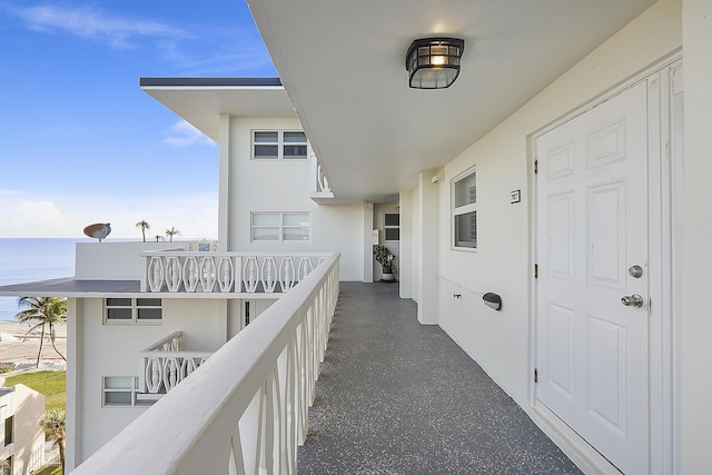 balcony featuring a water view