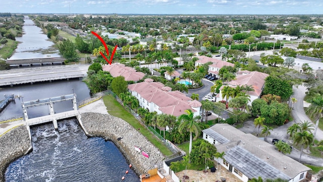 birds eye view of property with a water view