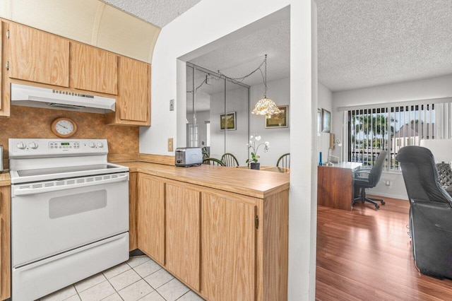 kitchen featuring decorative backsplash, hanging light fixtures, light tile patterned floors, white electric range oven, and a textured ceiling