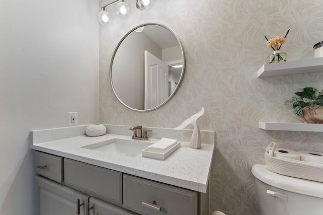 bathroom with vanity and toilet