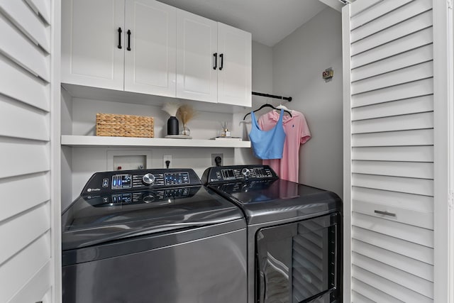 laundry area featuring cabinets and washer and dryer