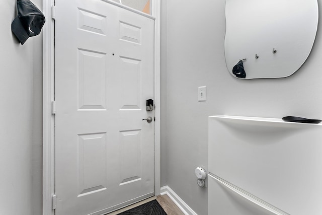 doorway with wood-type flooring