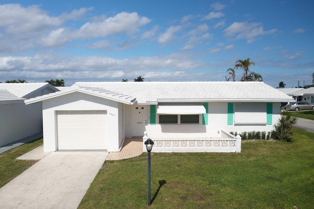 ranch-style house with a garage and a front yard