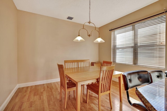 dining space featuring light hardwood / wood-style flooring