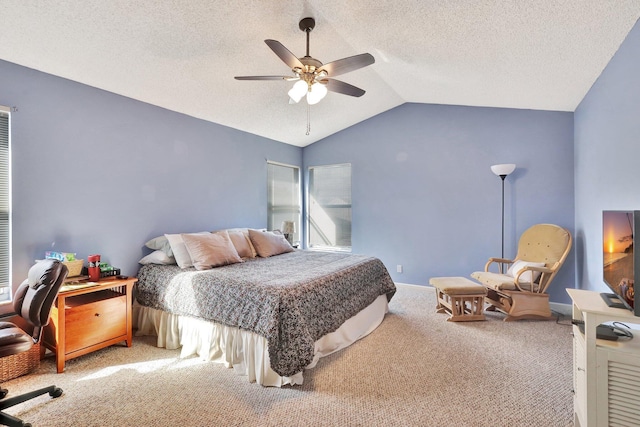 bedroom featuring lofted ceiling, carpet flooring, a textured ceiling, and ceiling fan