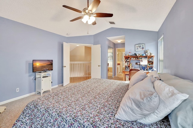 bedroom featuring vaulted ceiling, carpet, and ceiling fan