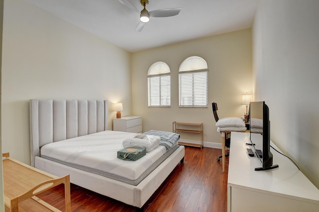 bedroom featuring ceiling fan and dark hardwood / wood-style flooring