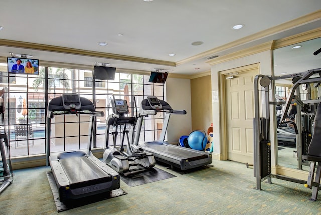 gym with crown molding and carpet floors